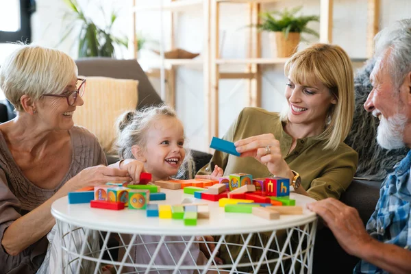 Cheerful multi-generation family having fun while spending time together at home. People happiness concept.