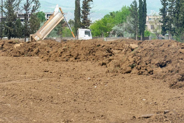 Pile of brown Soil. Construction dirt pile. Industry