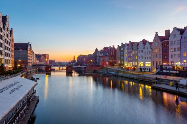 Gdansk, Poland - 12 March, 2022: Scenic summer evening panorama of the architectural embankment pier canal river in Gdansk
