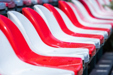 Red and white seats in a street stadium. Sport