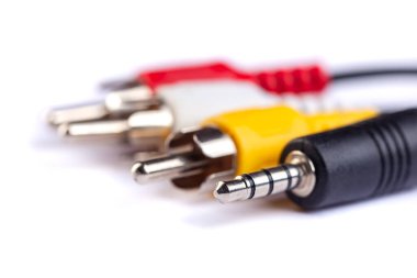 Electric plug of television and audio-video power supply on white backgrund. RGB cabel