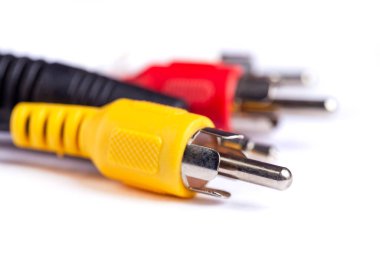 Electric plug of television and audio-video power supply on white backgrund. RGB cabel