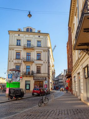 Krakow, Poland - 13 March, 2022: Street with historical houses in Krakow old town, Poland