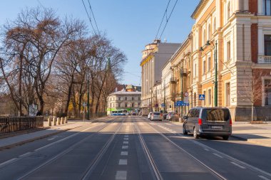 Krakow, Poland - 14 March, 2022: Street with historical houses in Krakow old town, Poland