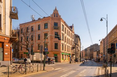 Krakow, Poland - 13 March, 2022: Street with historical houses in Krakow old town, Poland