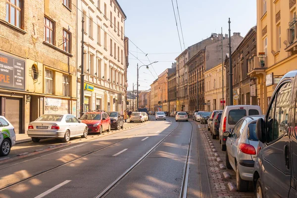 Krakow, Poland - 13 March, 2022: Street with historical houses in Krakow old town, Poland