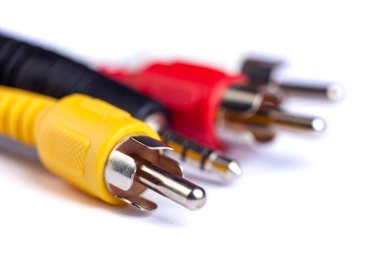 Electric plug of television and audio-video power supply on white backgrund. RGB cabel