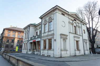 Krakow, Poland - 13 March, 2022: Street with historical houses in Krakow old town, Poland