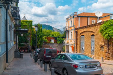 Tbilisi, Georgia - 09 August, 2022: Old houses at the Avlabari district in Tbilisi. Metekhi church. Travel