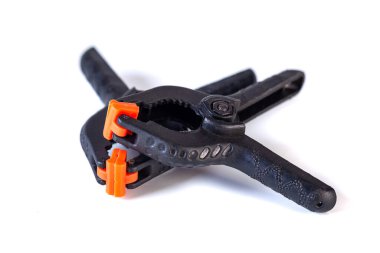 Two platic clips used in photo studio for clamp background and other things, object