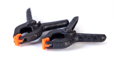 Two platic clips used in photo studio for clamp background and other things, object