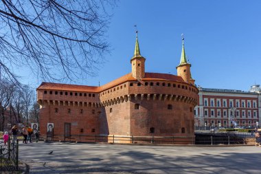 Krakow, Poland - 14 March, 2022: Stone medieval city gate Barbican. Travel
