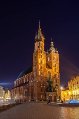 Old town square in Krakow at night, Poland. St. Marys Basilica. Travel