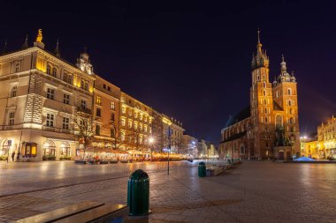 Old town square in Krakow at night, Poland. St. Marys Basilica. Travel