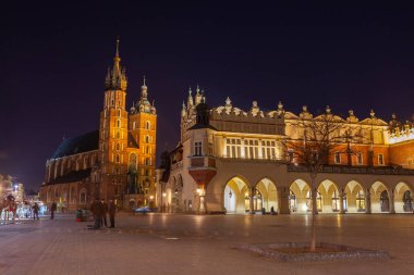 Old town square in Krakow at night, Poland. St. Marys Basilica. Travel
