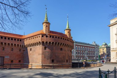 Krakow, Poland - 14 March, 2022: Stone medieval city gate Barbican. Travel