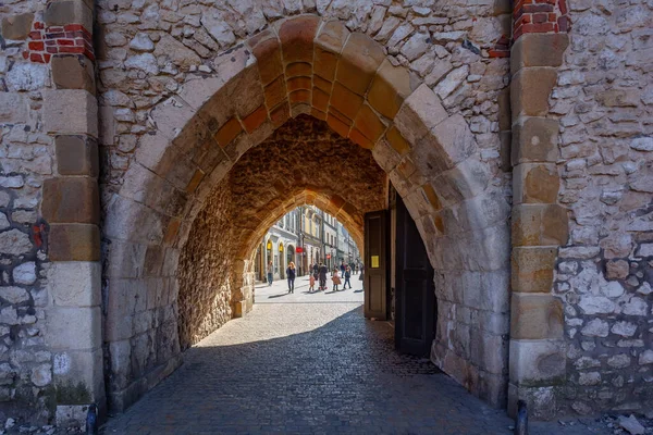 Krakow, Poland - 14 March, 2022: Particular the St. Florian's gate, north side, mix of millenary history and modernity in Krakow