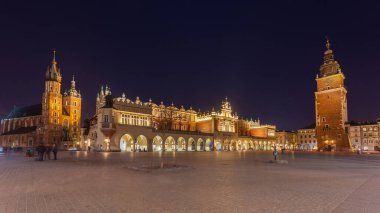 Old town square in Krakow at night, Poland. St. Marys Basilica. Travel