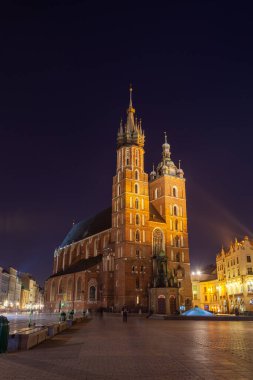 Old town square in Krakow at night, Poland. St. Marys Basilica. Travel