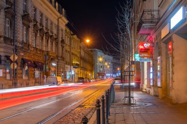 Krakow, Poland - 14 March, 2022: Night view of Krakow streets. Travel