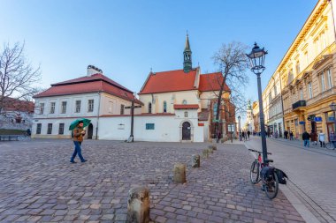 Krakow, Poland - 14 March, 2022: A cross on the square in front of the Church of St. Giles in memory of the Polish victims in Katyn in 1940. Travel