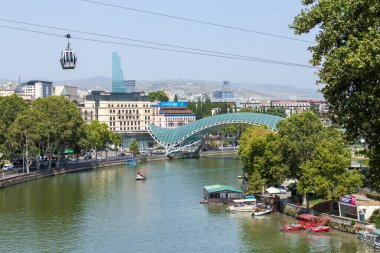 Tbilisi, Georgia - 22 August, 2022: The view on the Peace Bridge from Metekhi Church. Travel