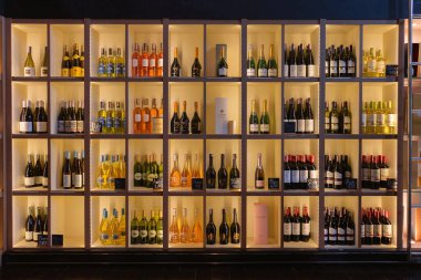 NAKHON RATCHASIMA, THAILAND- July 13, 2022: various kinds of wine and champagne in wooden shelves for sale
