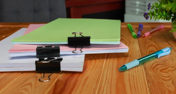 office supplies and document on table in office