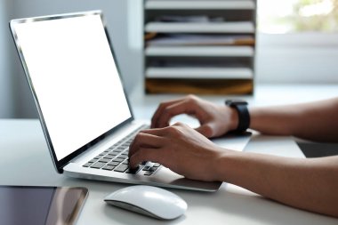 Cropped shot businessman working with computer tablet at home.	