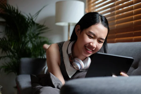 Smiling Young Woman Sitting Comfortable Sofa Using Digital Tablet — стокове фото