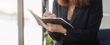 Close up view creative woman working with digital tablet.	