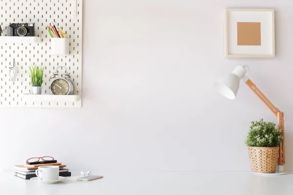 Mockup workspace desk and copy space books,plant and coffee on white desk.	