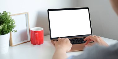 Close up view man freelancer working with computer laptop in living room.
