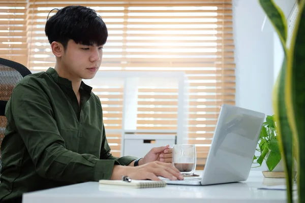 Young Asian Man Holding Coffee Cup Working Laptop Computer Home — Stock Photo, Image