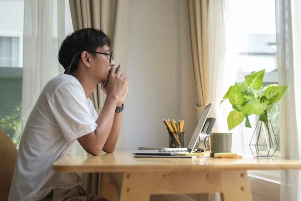 Thoughtful Young Man Sitting Bright Living Room Computer Laptop Looking — 스톡 사진