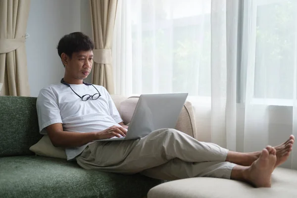 Happy Young Man Sitting Couch Living Room Using Laptop Computer — 스톡 사진