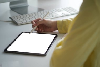 Designer woman working with digital tablet in creative office.	