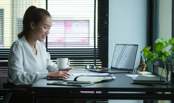 Cheerful Young Asian Female Entrepreneur Sitting Bright Modern Office Working — Φωτογραφία Αρχείου