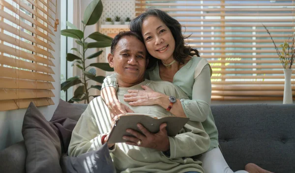 Loving Retired Couple Enjoying Peaceful Moment Relaxing Together Sofa Bright — Foto Stock