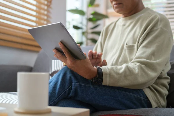 Retired Asian Men Sitting Couch Using Digital Tablet Browsing Internet — Zdjęcie stockowe