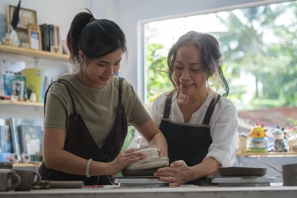 Mature Woman Teaching Young Woman Making Ceramics Pottery Workshop — Photo