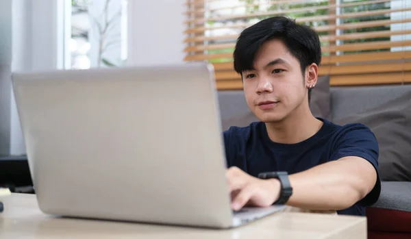 Smiling Handsome Asian Man Sitting Floor Living Room Using Laptop — 图库照片