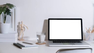 Mock up laptop computer with empty screen, coffee cup, potted plant on white working desk.