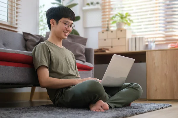 Smiling Asian Man Casual Clothes Using Laptop Browsing Internet Working — Stockfoto