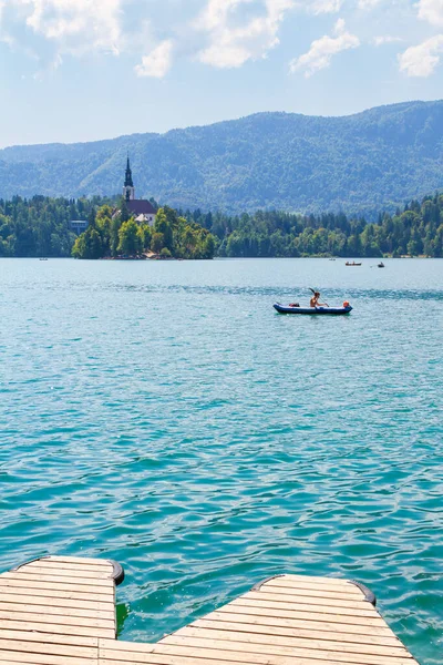 Lake Bled, Slovenia - August 20, 2018: People enjoy the water and landscape in summer by kayak and row boat