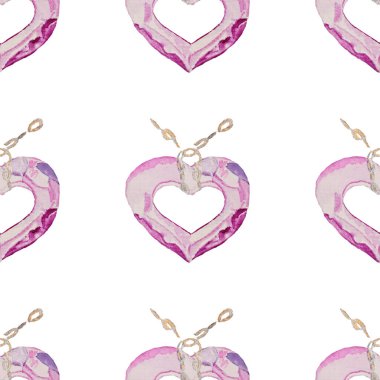 Pembe, yeşil taştan yapılmış bir kalp kolyesi. Zincirin üzerinde değerli bir kolye. Çok renkli yüzler.