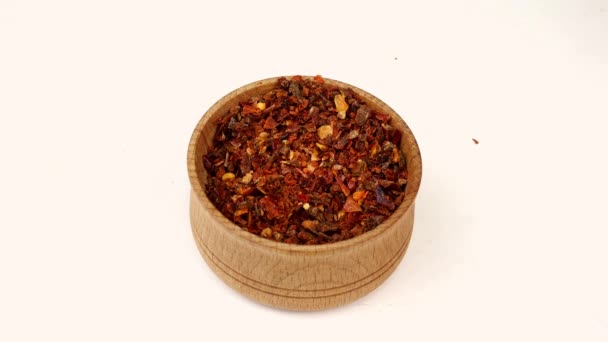Chef taking spices paprika or chili flakes from wooden spice jar. Close-up. — Stock Video