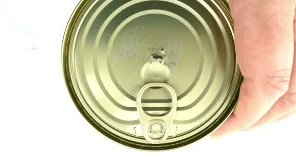 Hand opens metallic tin can stewed meat. Lifts the metal cover. Fast canned food concept. Top view. — Stock Video