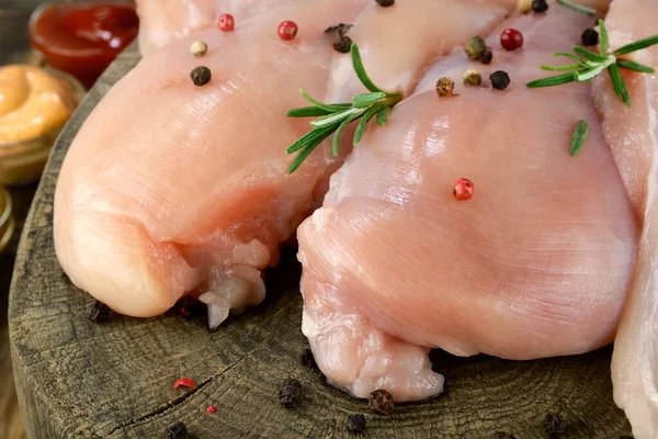 Fresh Raw Chicken Breast Fillets Sprinkled Peppercorns Rosemary Sauces Wooden Stock Photo