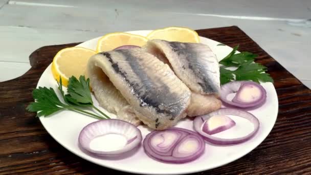 Tasty Salted Herring Fish Fillet Onion Rings Lemon Parsley Rotate — Video